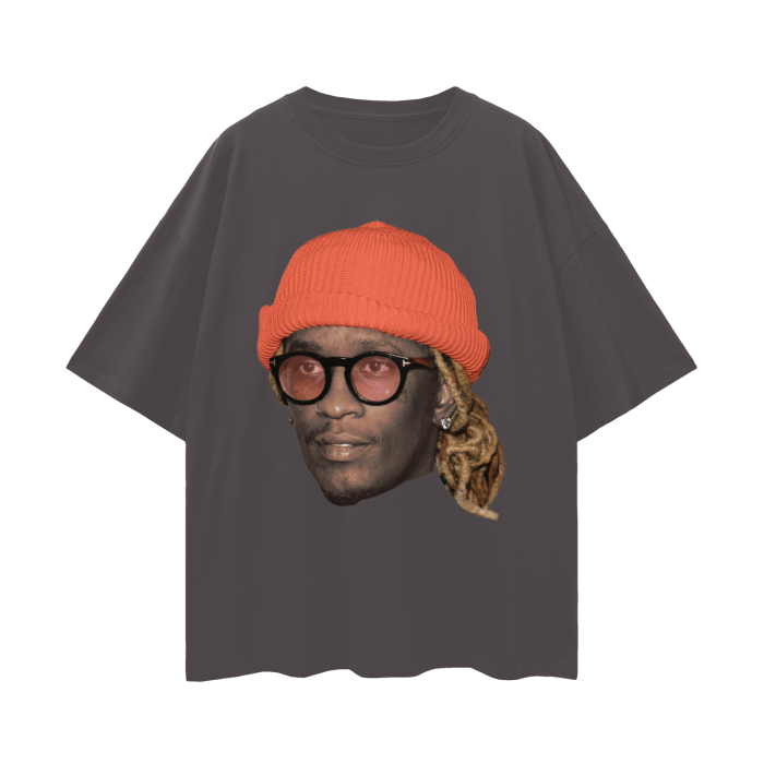 Front view of an oversized dark grey t-shirt with a large graphic of Young Thug's face wearing an orange beanie and glasses.