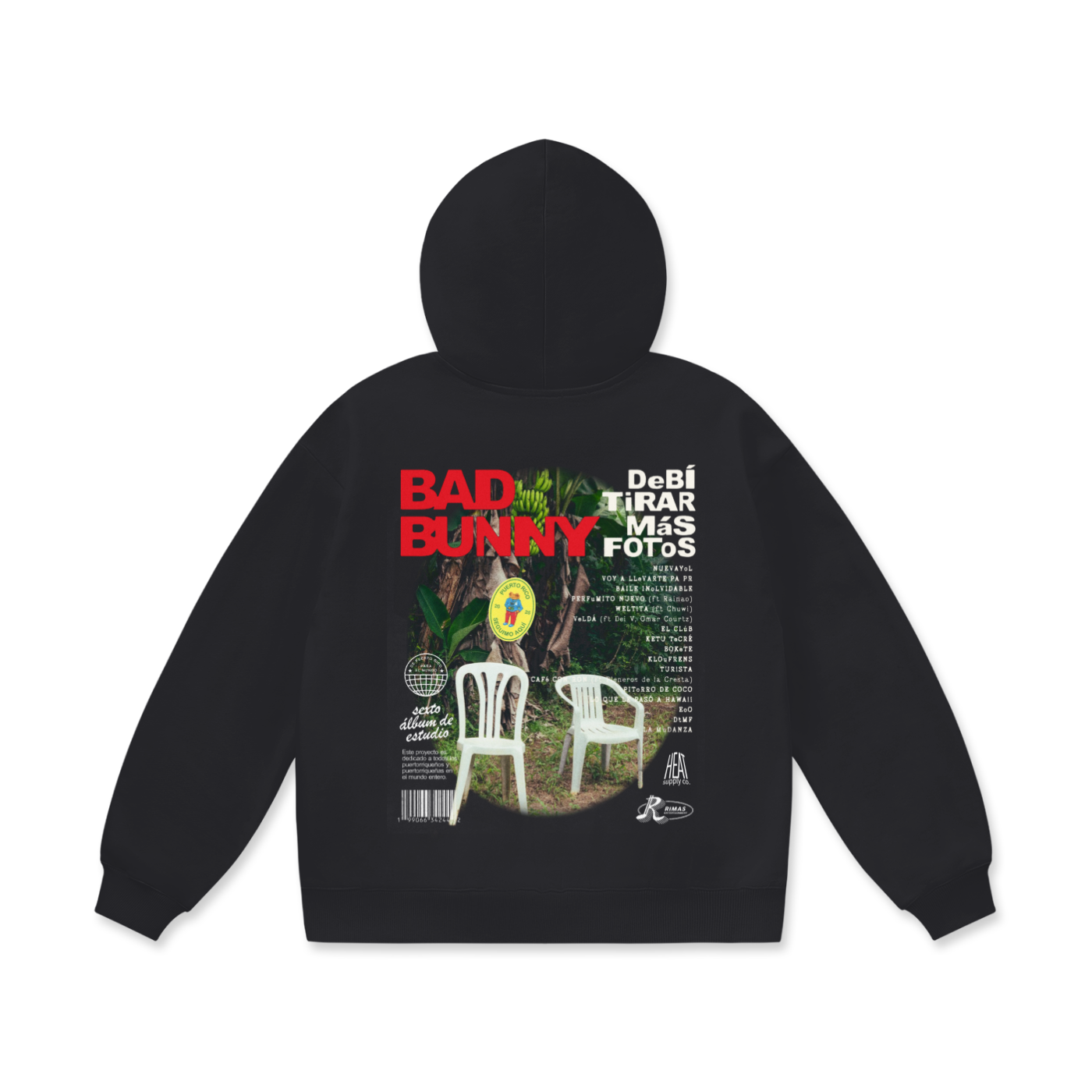 Black boxy-fit T-shirt featuring a bold graphic design on the back with 'Bad Bunny' in red text and 'Debí Tirar Más Fotos' in white text, accompanied by a nature-inspired image with white plastic chairs and tropical greenery. The front of the tee displays 'Debí Tirar Más Fotos' in white text across the chest. Designed with a loose, drop-shoulder fit and half sleeves.