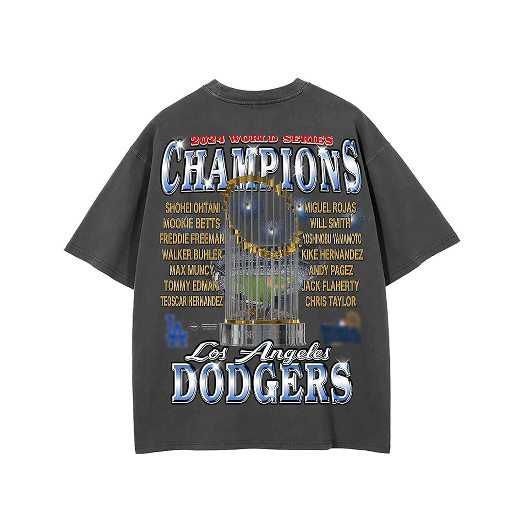 Back view of a 2024 Los Angeles Dodgers World Series Champions tee featuring a large image of the championship trophy, surrounded by the names of key players in gold text. The design includes "Champions" in bold letters at the top and "Los Angeles Dodgers" in blue and white at the bottom, celebrating the team’s victorious season.