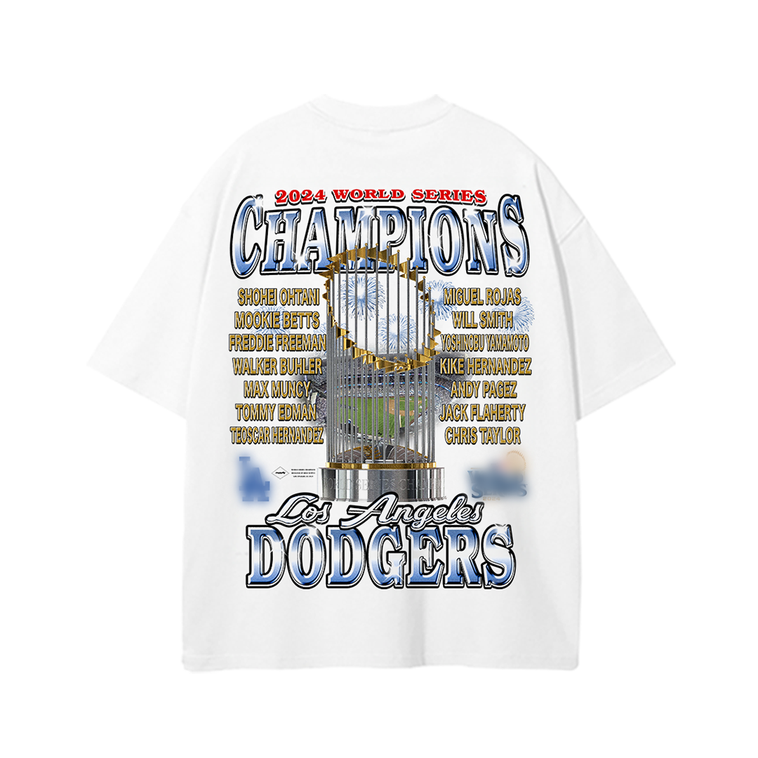 Back view of a 2024 Los Angeles Dodgers World Series Champions tee featuring a large image of the championship trophy, surrounded by the names of key players in gold text. The design includes "Champions" in bold letters at the top and "Los Angeles Dodgers" in blue and white at the bottom, celebrating the team’s victorious season.