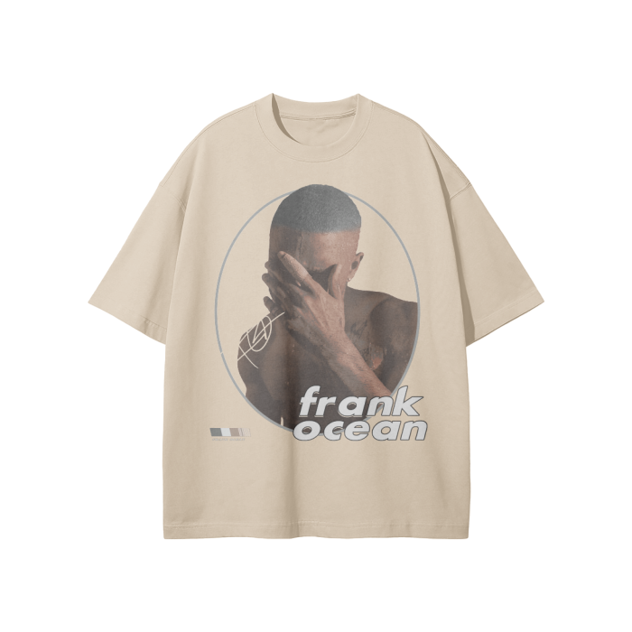A Light Apricot-colored oversized t-shirt with a minimalist graphic design showing Frank Ocean covering his face with his hand. The design includes circular outlines around the image, with "frank ocean" written in a sleek font below.