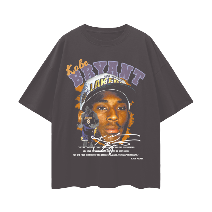 A vintage-style oversized tee featuring a bold graphic of Kobe Bryant during his rookie years with the Los Angeles Lakers. The shirt showcases a large image of Kobe wearing a Lakers cap, with an additional smaller image of him in his #8 jersey. Below the graphic is Kobe's signature and an inspirational quote from him. The shirt is acid-washed black, has a loose, drop-shoulder fit, and is made from 100% cotton. Perfect for basketball fans and collectors.