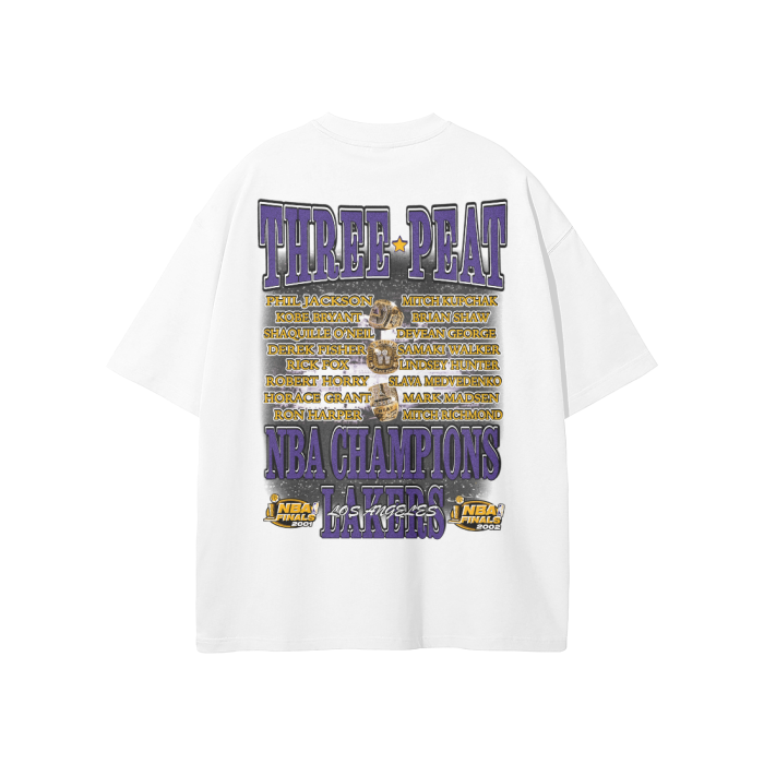 The back of a white oversized T-shirt listing the players and staff involved in the Lakers’ three-peat championships. The text "Three-Peat NBA Champions Lakers" is prominently displayed in purple and gold