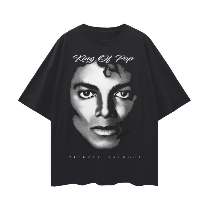 A black lightweight oversized t-shirt featuring a large grayscale portrait of Michael Jackson's face, with the text "King Of Pop" in elegant white script above the image and "MICHAEL JACKSON" in small white letters below.