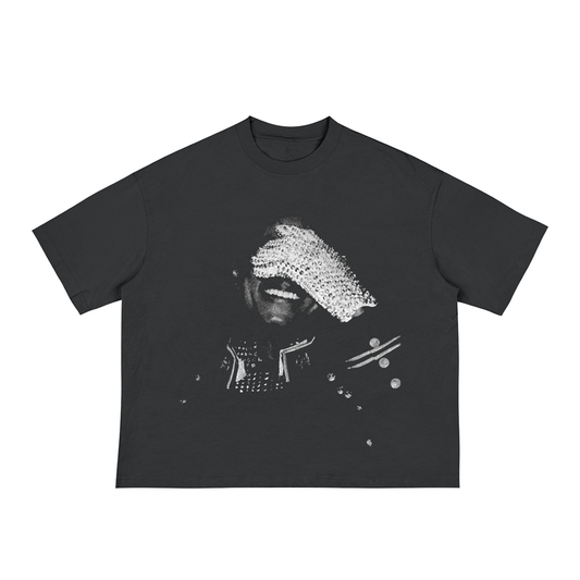Black unisex t-shirt with a black-and-white photo of Michael Jackson smiling and covering his eyes with a sparkling rhinestone glove, wearing a studded performance jacket.