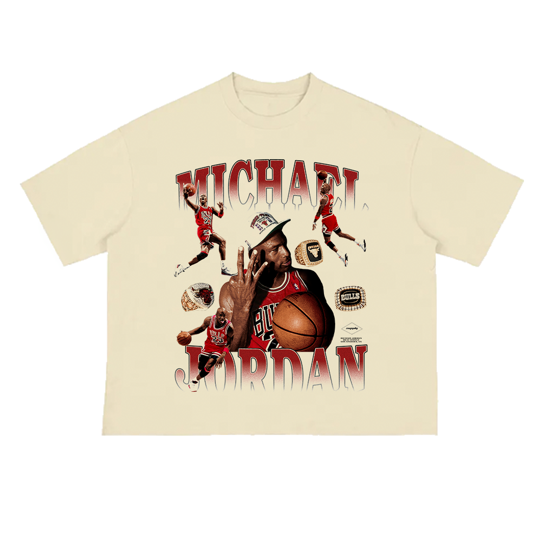 Beige unisex t-shirt featuring a large graphic collage of Michael Jordan in various poses wearing a Chicago Bulls uniform, with championship rings and text reading “MICHAEL JORDAN” in bold red gradient letters.