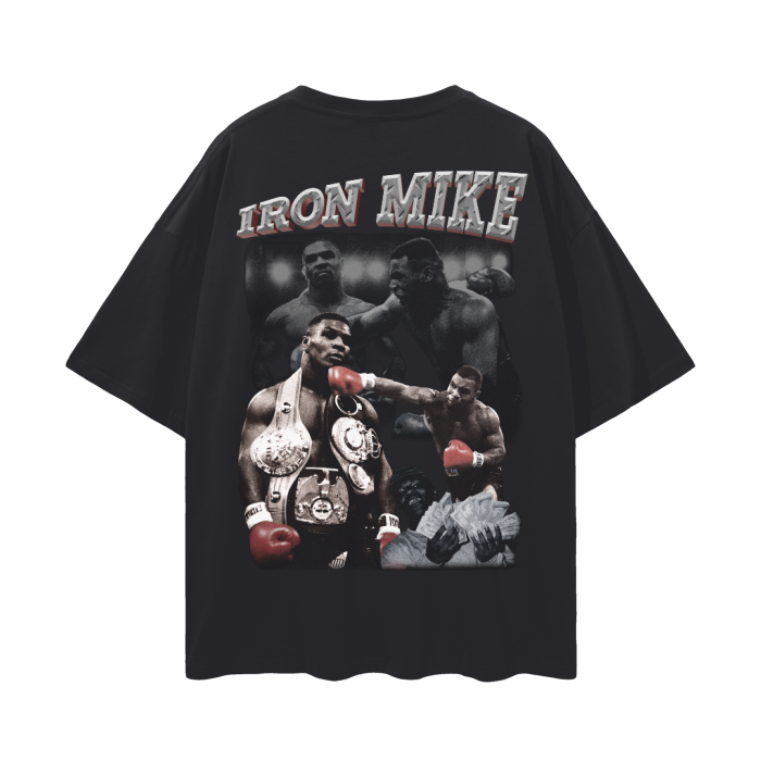 A black oversized t-shirt featuring a graphic of Mike Tyson, also known as "Iron Mike," in various iconic boxing poses. The design highlights his muscular physique, championship belts, and intense facial expressions, capturing his legendary status in the sport of boxing.