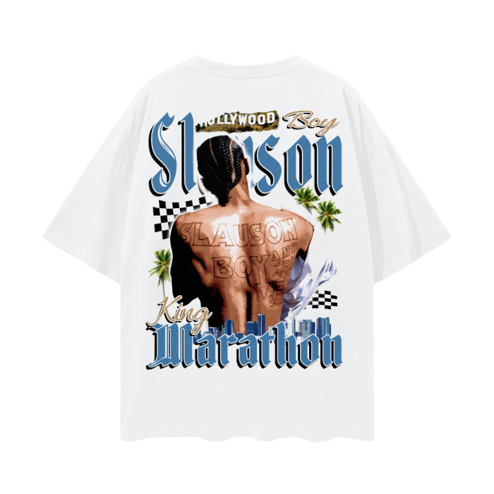 A white T-shirt featuring a graphic of the back of Nipsey Hussle with braided hair and multiple tattoos, prominently displaying "Slauson Boy" across his back. The text "Slauson" is written above the image in large, stylized letters, with "King Marathon" below. The design includes palm trees and a cityscape, with a checkered flag pattern in the background.