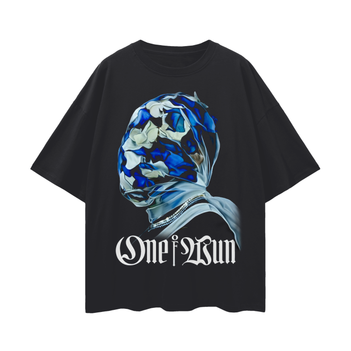 A black oversized t-shirt featuring a striking design of a person with their head wrapped in a blue and white patterned cloth, covering their face entirely. Below the image, the text "One of Wun" is displayed in a gothic-style font. The overall design gives off a mysterious and artistic vibe.