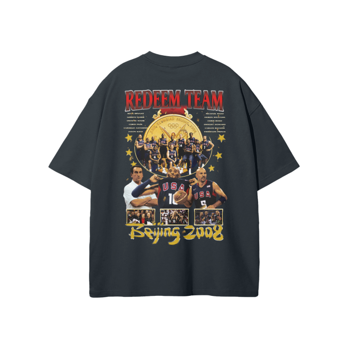 he back of the black oversized t-shirt features a large "Redeem Team" graphic celebrating Team USA's gold medal victory at the 2008 Beijing Olympics. The design includes images of the players, a gold medal, and the words "Beijing 2008" in bold yellow lettering.