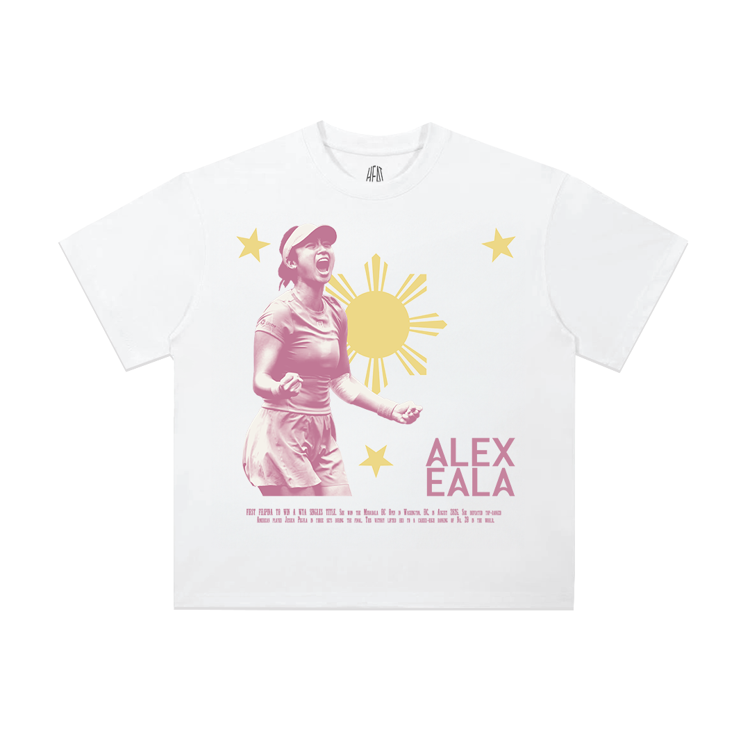Heavyweight white cotton T-shirt featuring Alex Eala celebrating in front of the Philippine sun and stars on the front, with a bold "Be Ambitious. Dream Big." graphic across the back in pink typography, creating an inspiring Filipino tennis streetwear design.