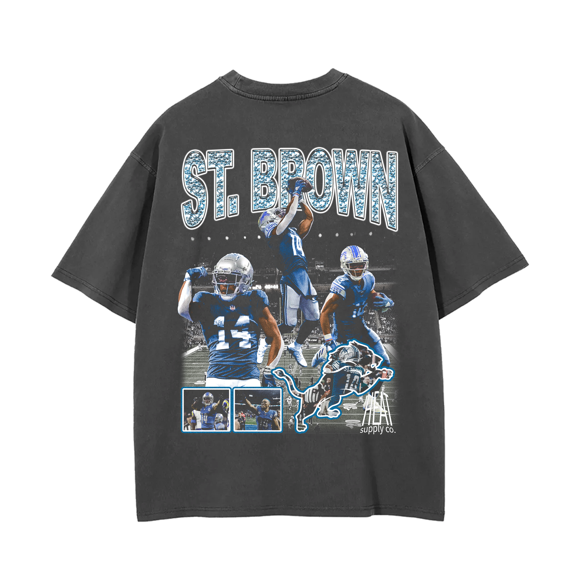 Grey oversized t-shirt featuring multiple action shots of Amon-Ra St. Brown, a wide receiver for the Detroit Lions. The text 'ST. BROWN' is printed across the top with a lion mascot graphic and additional player images below