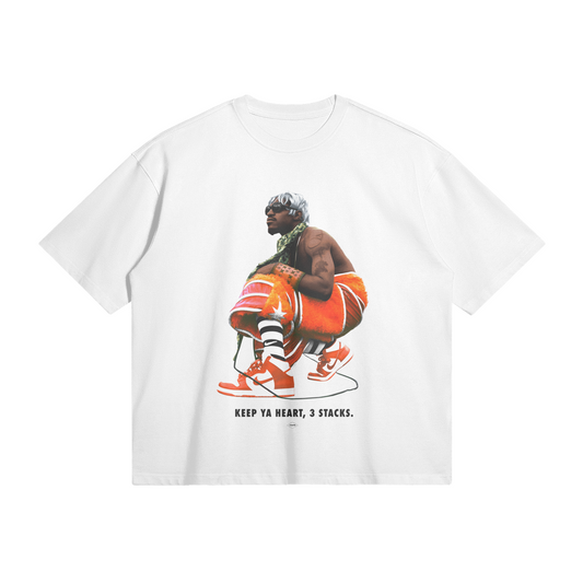White T-Shirt featuring a graphic of Andre 3000 squatting in a colorful outfit with the text 'KEEP YA HEART, 3 STACKS.' underneath, capturing a retro and vibrant style.