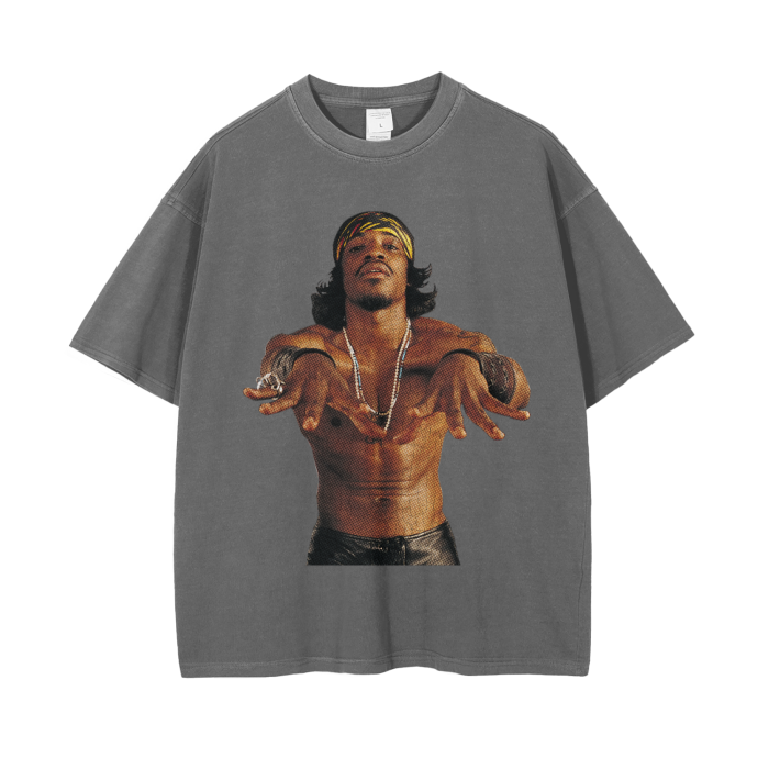 Grey Green-colored oversized t-shirt featuring a large image of André 3000, shirtless, with a confident pose and wearing a headband, necklaces, and bracelets. The image captures his distinctive style and charismatic personality.