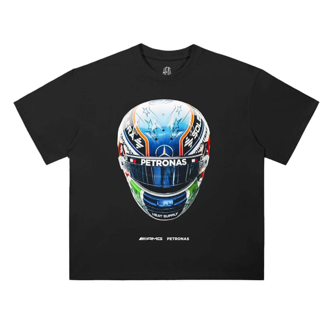 Black oversized cotton T-shirt featuring a detailed racing helmet graphic with AMG Petronas branding and Mercedes Formula 1 team styling.