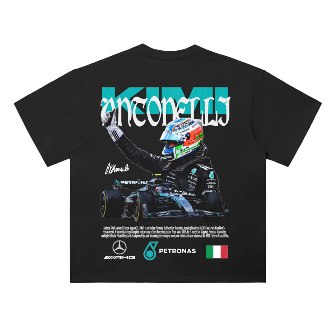 Black drop-shoulder graphic tee showing Andrea Kimi Antonelli celebrating with raised arm alongside a Mercedes Formula 1 racecar and stylized “Kimi Antonelli” typography with AMG Petronas logos.