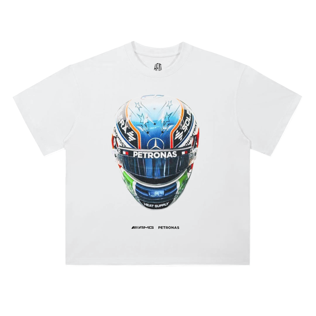 White oversized cotton T-shirt featuring a detailed racing helmet graphic with AMG Petronas branding and Mercedes Formula 1 team styling.