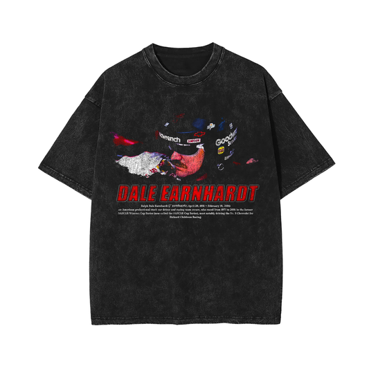 A vintage black-washed t-shirt featuring a detailed print of Dale Earnhardt in his racing helmet, with "Dale Earnhardt" in bold red letters and other racing motifs in a distressed design.