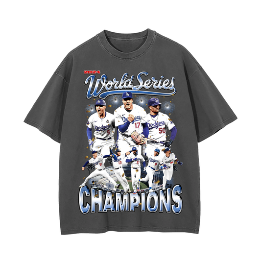 Front view of an oversized Dodgers 2024 World Series Champions tee featuring key Dodgers players celebrating on a white background with vibrant “World Series Champions” text.