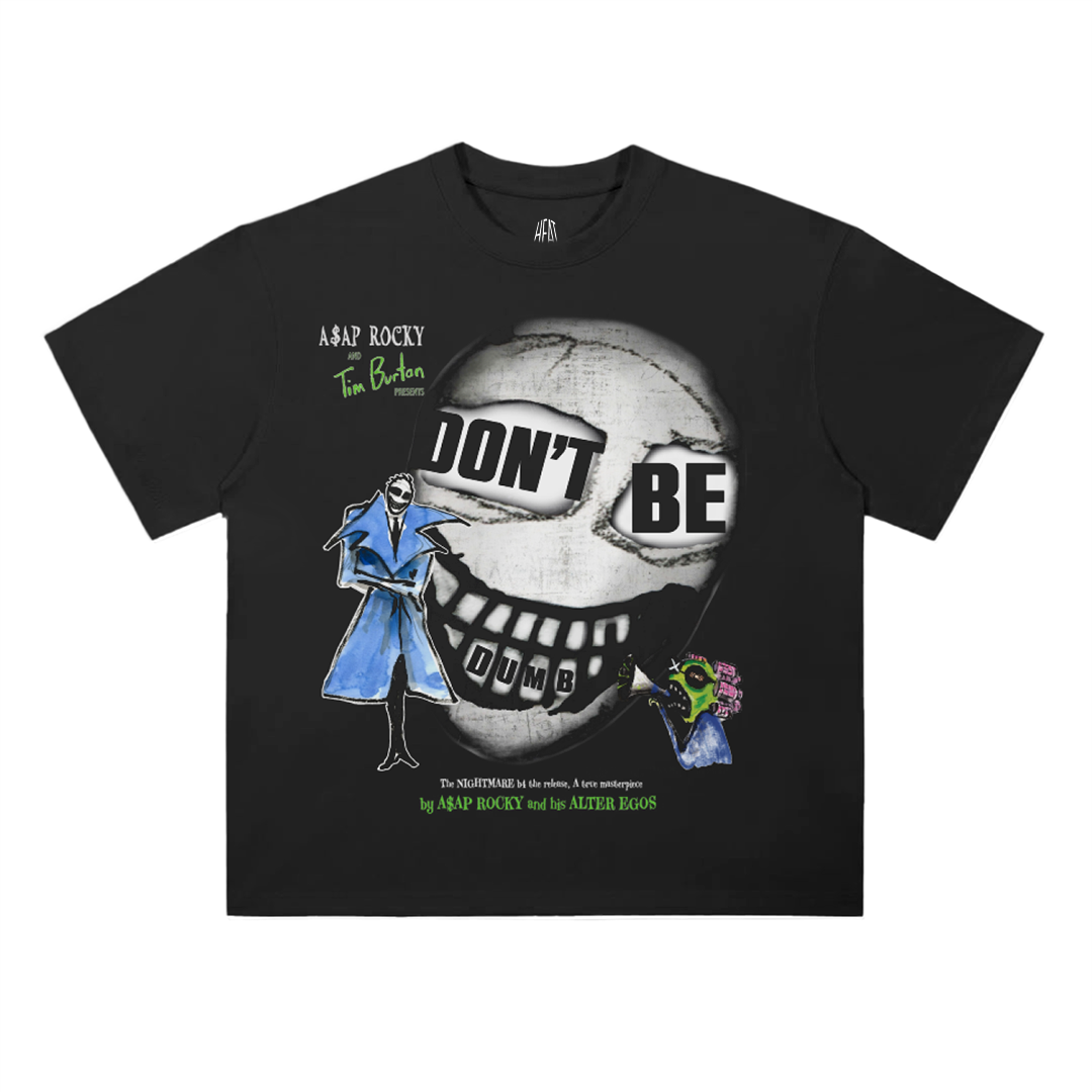 Black oversized drop shoulder T-shirt featuring large “DON’T BE DUMB” typography over a surreal skull face graphic with illustrated alter ego characters inspired by A$AP Rocky album artwork.