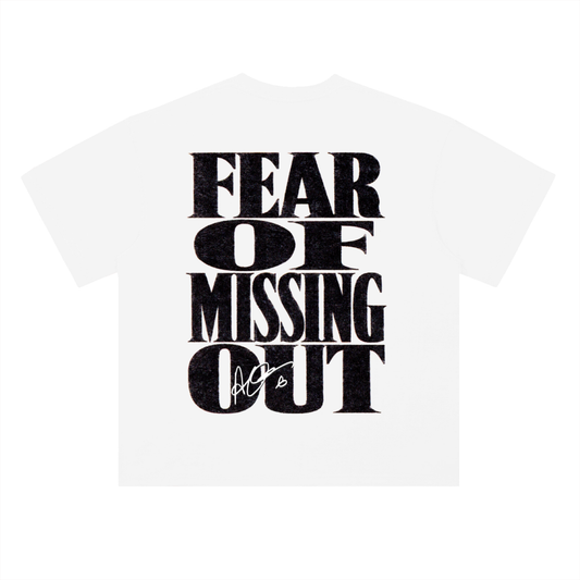 White heavyweight cotton T-shirt featuring a minimalist "FOMO" chest graphic on the front and a bold oversized "Fear Of Missing Out" typography design across the back, inspired by modern hip-hop streetwear aesthetics.