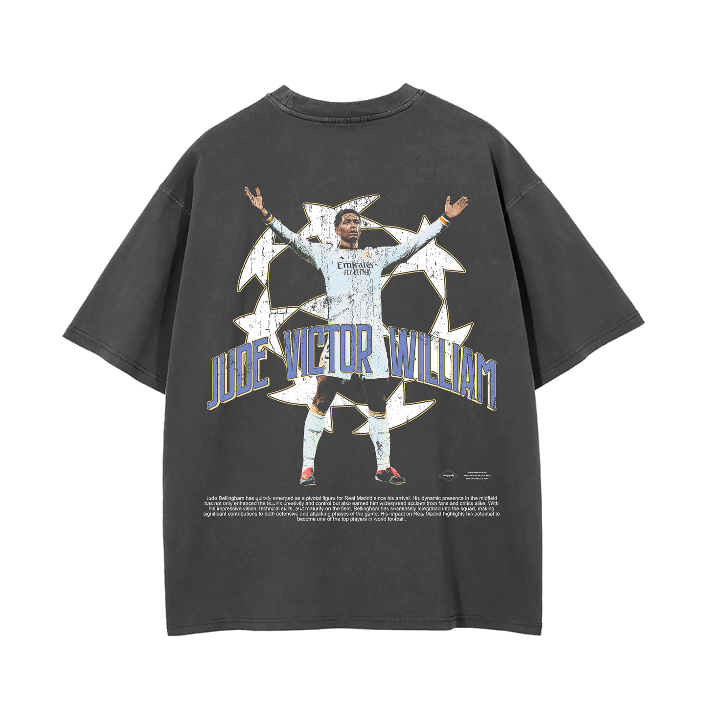 The back of the oversized vintage wash tee showcases a large graphic of Jude Bellingham celebrating with his arms outstretched, surrounded by a stylized soccer ball design, along with his full name, "Jude Victor William," in bold text, completing the striking look of this Real Madrid tribute tee.