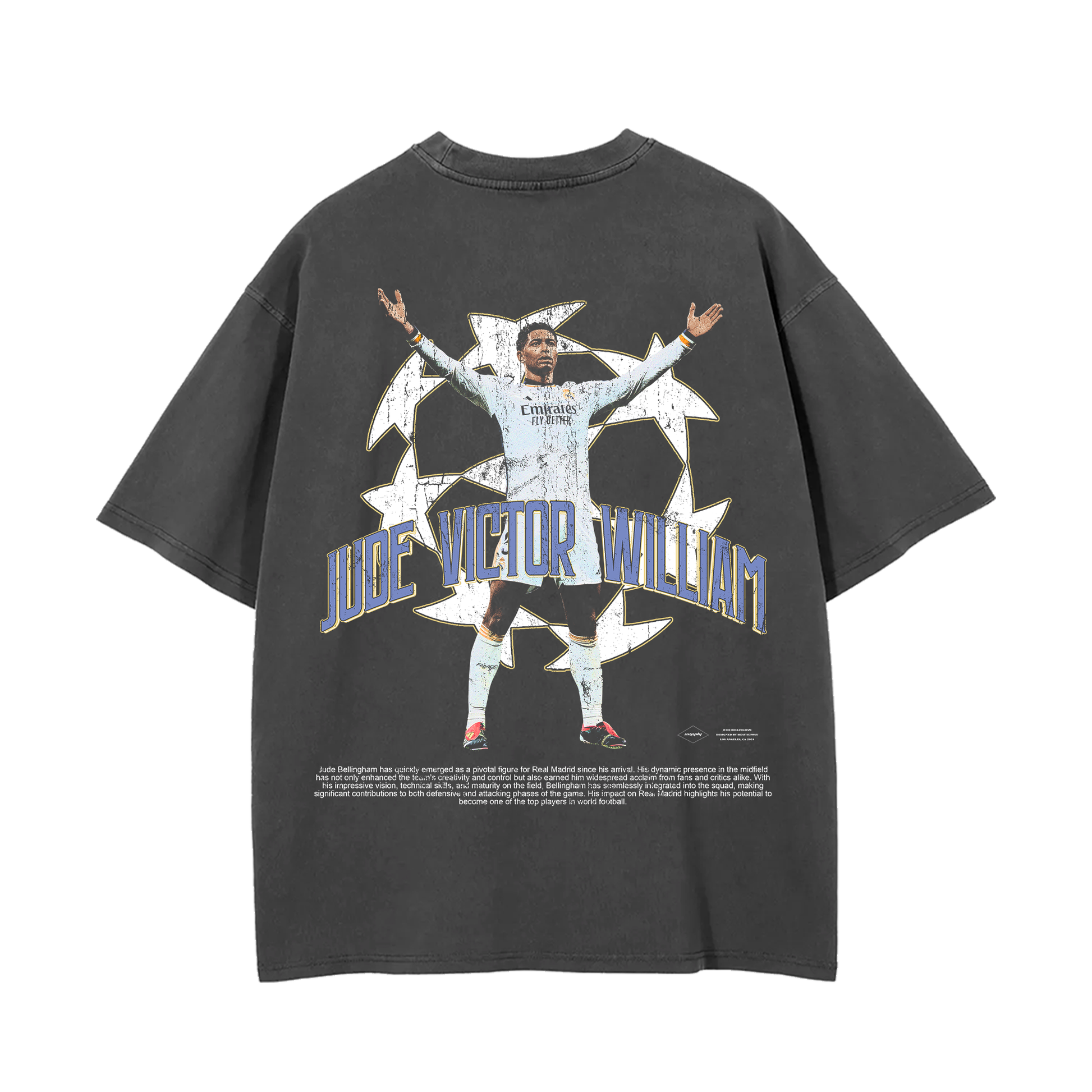 The back of the oversized vintage wash tee showcases a large graphic of Jude Bellingham celebrating with his arms outstretched, surrounded by a stylized soccer ball design, along with his full name, "Jude Victor William," in bold text, completing the striking look of this Real Madrid tribute tee.