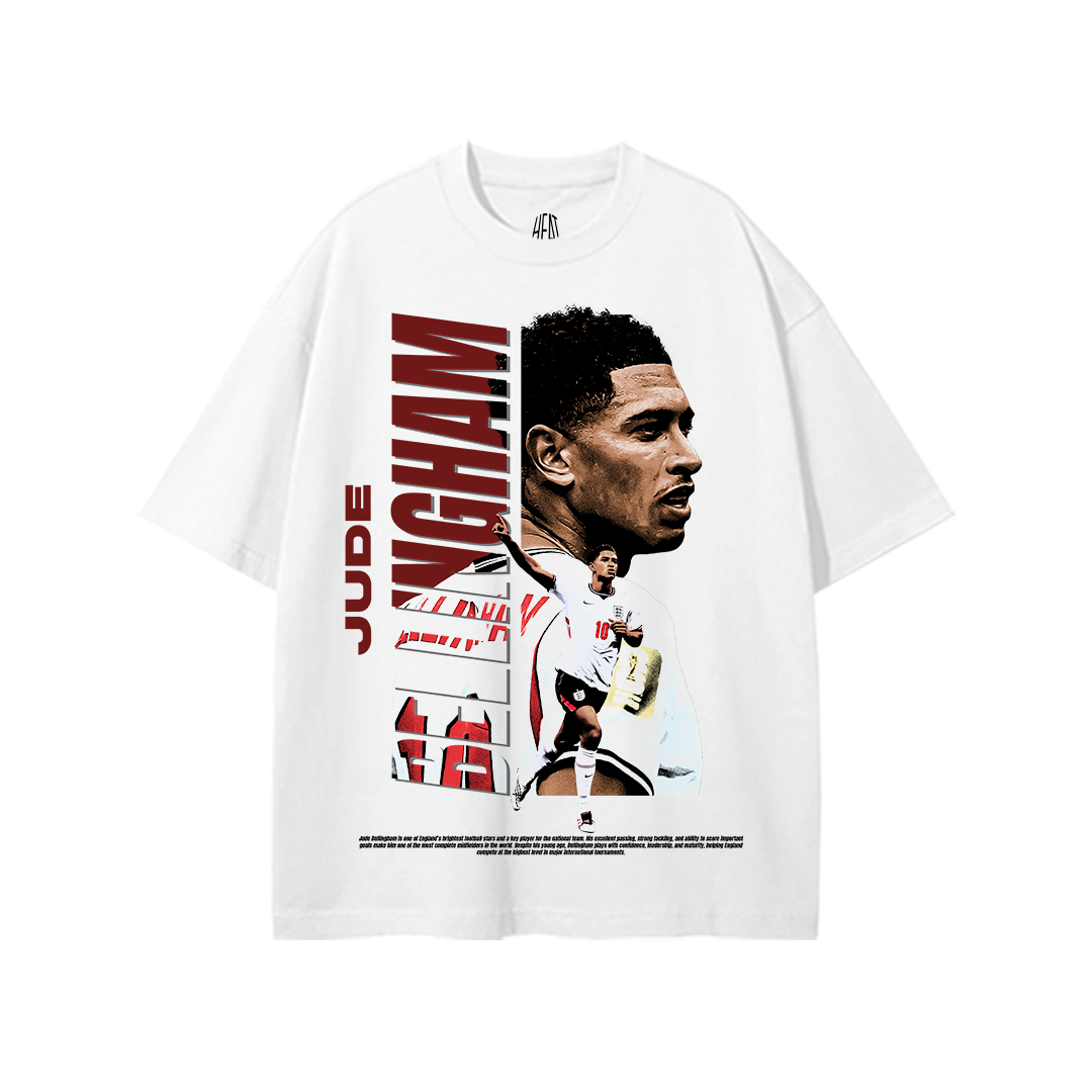 White heavyweight cotton standard fit T-shirt featuring an exclusive Jude Bellingham graphic with bold vertical "BELLINGHAM" typography, a large portrait, action pose in the England national team kit, and modern football-inspired graphics. Premium football streetwear design for England supporters.