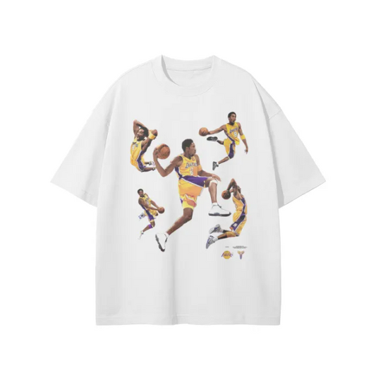A white oversized t-shirt featuring multiple images of Kobe Bryant in various action poses wearing the Los Angeles Lakers uniform.