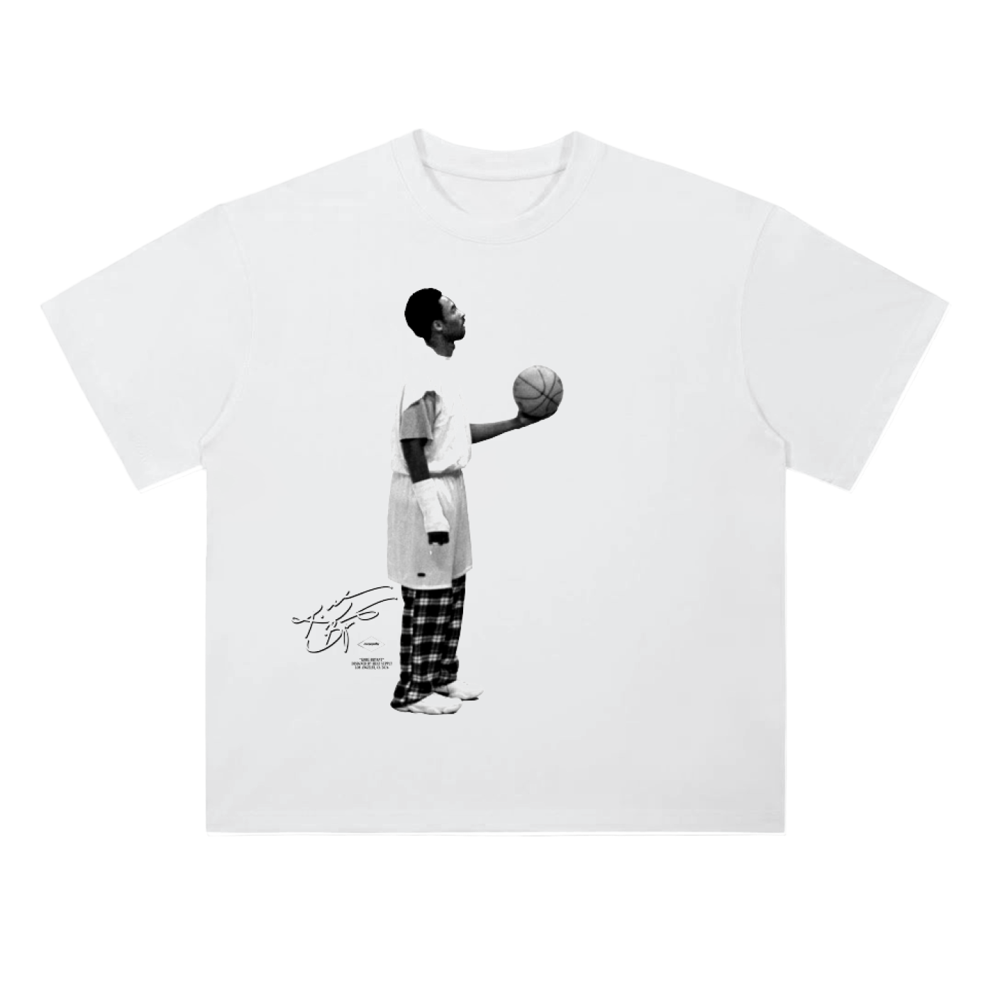 White oversized unisex cotton T-shirt featuring a minimalist black-and-white graphic of a basketball player holding a ball, with a small signature detail near the hem.