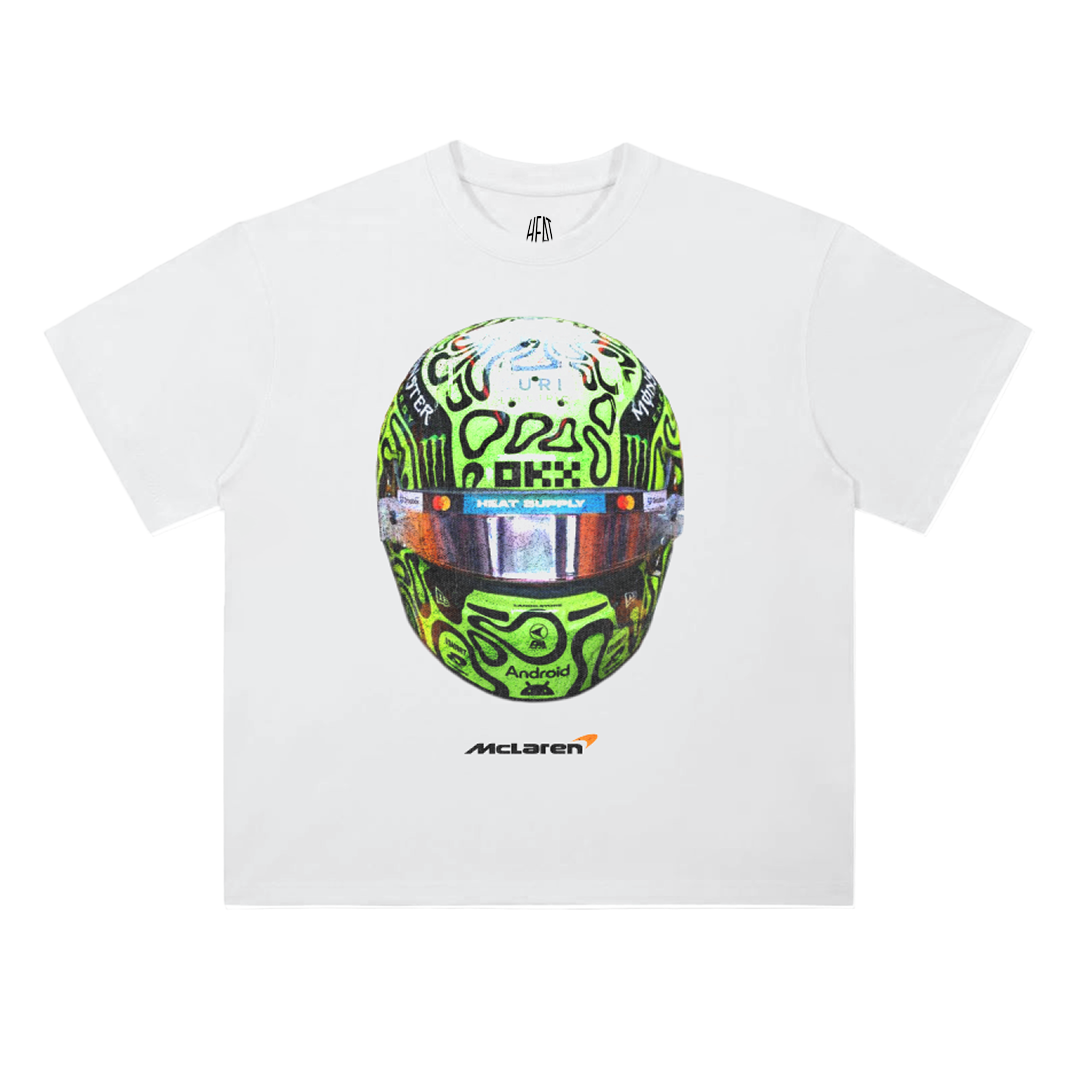 White oversized cotton T-shirt featuring a vibrant green racing helmet graphic inspired by Formula 1 driver Lando Norris, with McLaren text underneath.