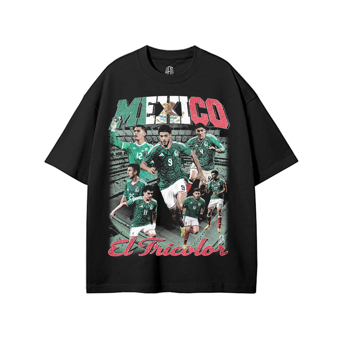 Black heavyweight Mexican National Soccer Team graphic T-shirt featuring a vintage-style El Tricolor player collage with bold Mexico lettering in green, white, and red and “El Tricolor” script across the bottom.
