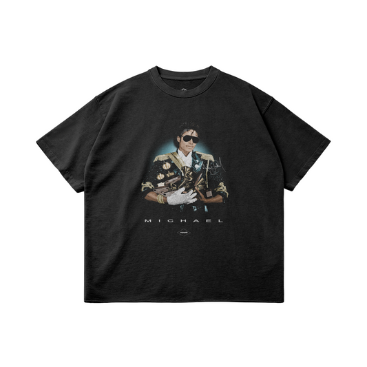 Black oversized vintage-style T-shirt featuring a portrait of Michael Jackson in a military-inspired jacket holding awards, with “MICHAEL” text beneath the graphic.