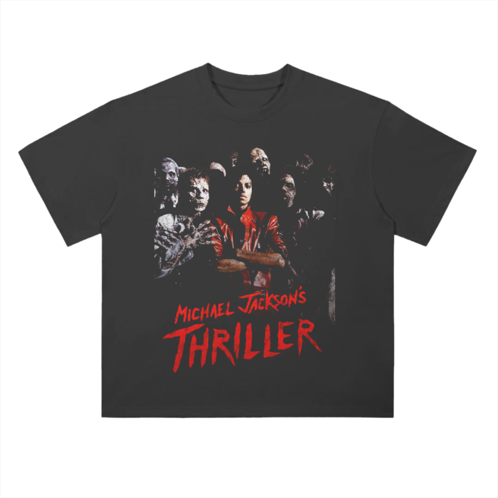 A black T-shirt featuring a graphic from Michael Jackson's iconic "Thriller" music video. The image shows Michael Jackson in his red jacket, surrounded by zombies. Below the image, "Michael Jackson's Thriller" is written in bold, red, jagged letters. The design evokes a classic horror movie 