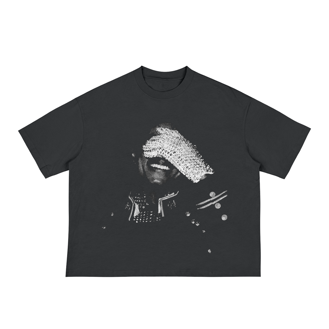 Black unisex t-shirt with a black-and-white photo of Michael Jackson smiling and covering his eyes with a sparkling rhinestone glove, wearing a studded performance jacket.