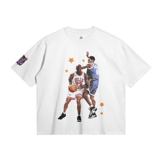 The back of the same T-shirt displays a detailed design with star patterns containing images of Kobe Bryant and Michael Jordan. The shirt lists several prominent NBA players, their numbers, and respective teams, forming a stylish tribute to basketball legends from the Eastern and Western conferences.