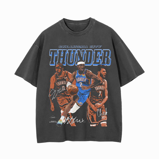 Grey unisex t-shirt featuring a bold “OKLAHOMA CITY THUNDER” text, with Shai Gilgeous-Alexander dribbling in the center, flanked by Jalen Williams and Chet Holmgren, along with their printed signatures.