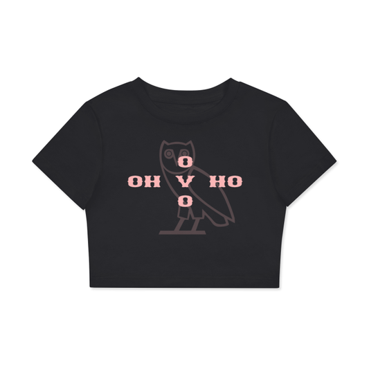A black cropped t-shirt featuring a minimalist owl design in the center, with the text "OH V HO" arranged in a cross pattern using pink letters