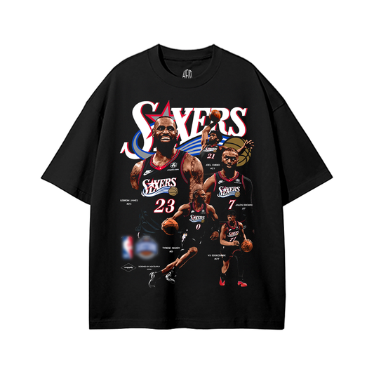 Black oversized unisex graphic T-shirt featuring a large Philadelphia 76ers-inspired basketball player collage with LeBron James, Joel Embiid, Tyrese Maxey, Jaylen Brown, and VJ Edgecombe. The design incorporates bold white SIXERS typography, red and blue basketball graphics, and player jersey numbers.
