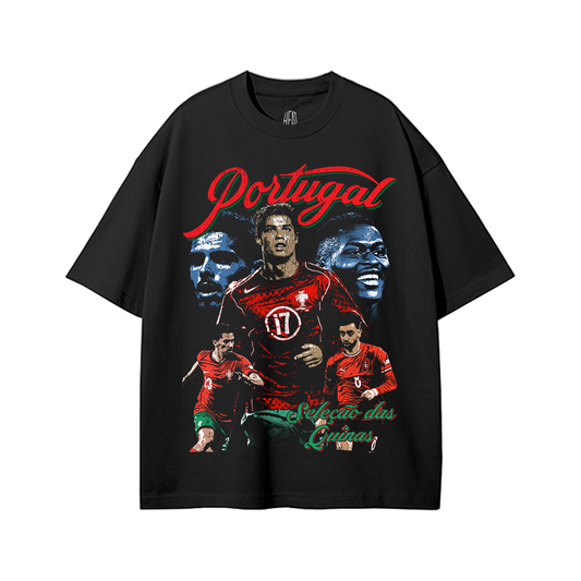 Black oversized Portugal soccer graphic t-shirt featuring vintage Cristiano Ronaldo inspired artwork, retro Portugal football graphics, and green-and-red Seleção das Quinas typography on a snow washed heavyweight tee.