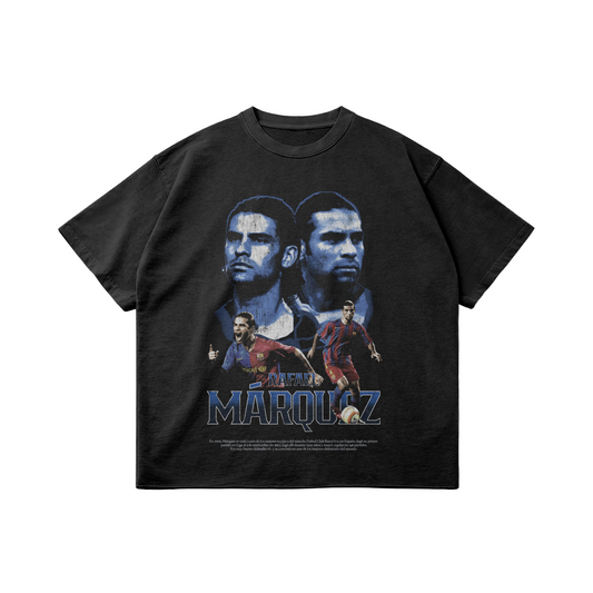 A black oversized t-shirt featuring a collage of Rafael Márquez, the legendary Mexican footballer, in various poses. The shirt displays two large portraits of Márquez in the background, with two smaller images of him in action wearing FC Barcelona's jersey in the foreground. The name "Rafael Márquez" is boldly printed at the bottom in a stylized font