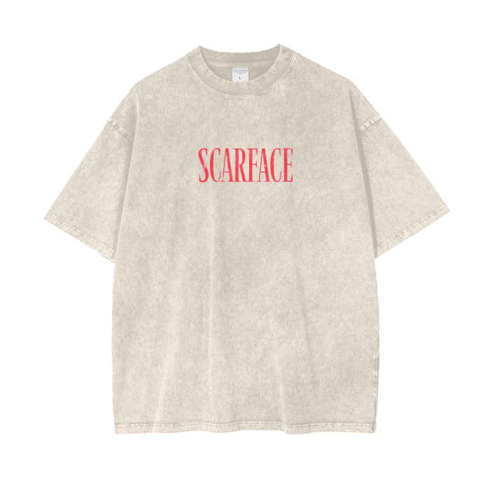 A beige oversized t-shirt with the word "SCARFACE" printed in red across the chest on a plain background