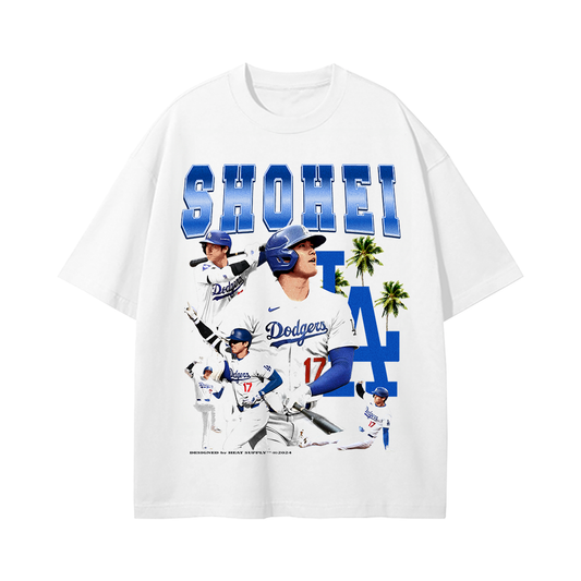 Front of the Shohei Ohtani Tee shows multiple action shots of Ohtani in a Dodgers uniform, set against a white backdrop with bold "Shohei LA" text in blue.