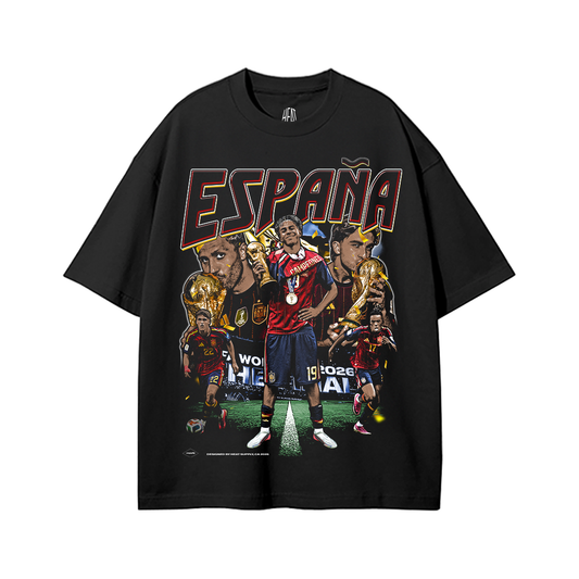 Black heavyweight cotton standard fit T-shirt featuring an exclusive España graphic with multiple Spain national team players celebrating victory, bold "ESPAÑA" typography, championship-inspired artwork, football trophy imagery, and La Furia Roja colors. Premium football streetwear design for Spain supporters.