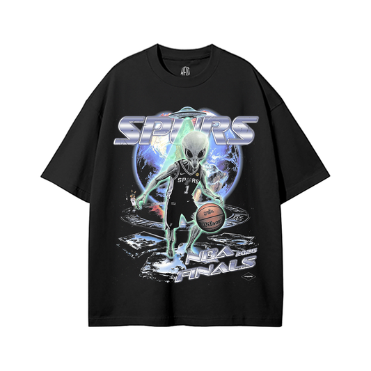 Black heavyweight drop shoulder t-shirt featuring a futuristic alien basketball player inspired by Victor Wembanyama, with cosmic space graphics, Spurs-themed artwork, NBA Finals-inspired typography, and a sci-fi streetwear aesthetic.