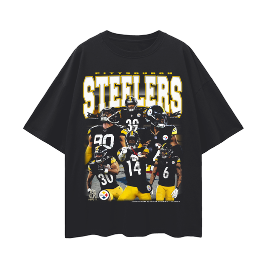 Front view of a black oversized Pittsburgh Steelers t-shirt featuring bootleg-style graphics of Steelers football players including Justin Fields and Jaylen Warren. The tee has a loose, drop shoulder fit and is designed for casual wear.
