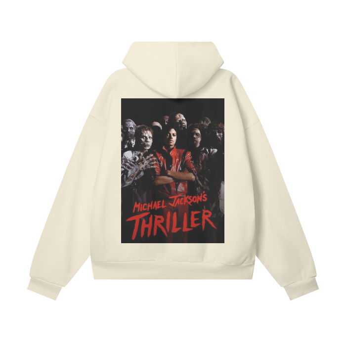 A beige oversized hoodie featuring a vibrant design on the back inspired by Michael Jackson's "Thriller." The design includes a central image of Michael Jackson in his iconic red jacket, surrounded by zombies. The text "Michael Jackson's Thriller" is written in bold red letters at the bottom of the image, capturing the essence of the legendary music video.