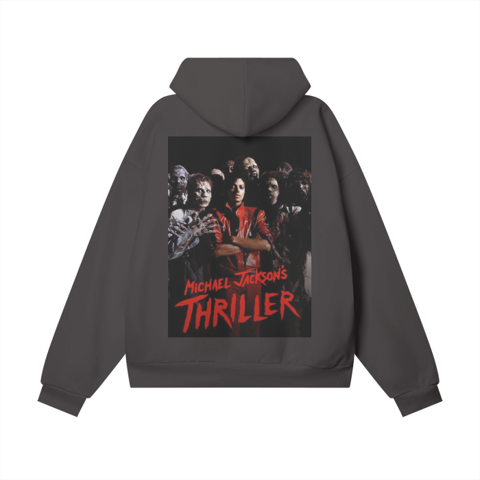 A brown oversized hoodie featuring a vibrant design on the back inspired by Michael Jackson's "Thriller." The design includes a central image of Michael Jackson in his iconic red jacket, surrounded by zombies. The text "Michael Jackson's Thriller" is written in bold red letters at the bottom of the image, capturing the essence of the legendary music video.