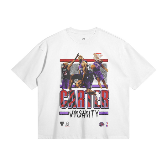 White t-shirt with a vibrant design featuring various action shots of Vince Carter in his Toronto Raptors uniform, with the text "CARTER" and "VINSANITY" in bold at the bottom.