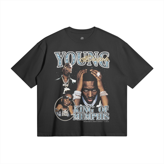  A black oversized t-shirt featuring a collage of Young Dolph, adorned with jewelry, with the text "YOUNG Dolph" at the top and "KING OF MEMPHIS" at the bottom in bold, stylized font.